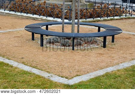 Wire Circular Benches Park Furniture In Winter. Sintered Gravel With The Help Of A Vibrating Roller.