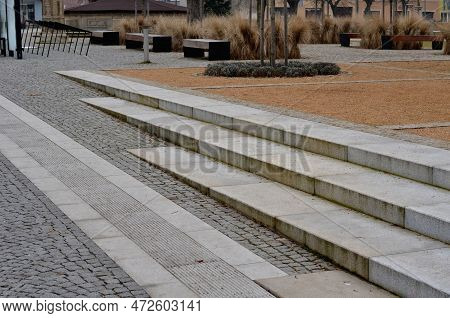 Wire Circular Benches Park Furniture In Winter. Sintered Gravel With The Help Of A Vibrating Roller.
