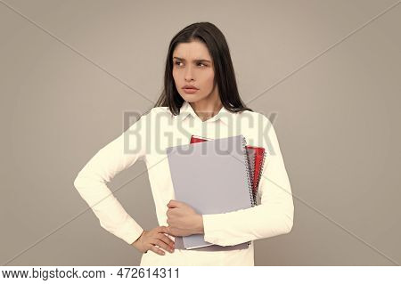 Portrait Of Student Woman. College Or High School Ducation. Serious Woman With Notebooks Smiling At 