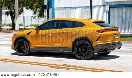 Miami Beach, Florida Usa - April 15, 2021: 2019 Yellow Giallo Auge Lamborghini Urus, Side View
