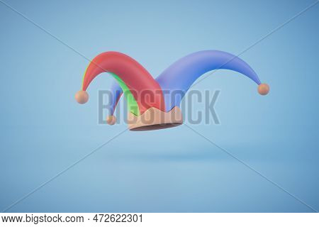A Multi-colored Jester Hat On A Blue Background. Copy Paste, Copy Space. 3d Render.