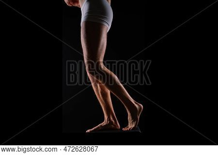 Close-up Of Bodybuilders Legs Ready For Competitive Sport White Panties
