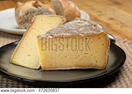 Pieces Of Cheese Tomme De Montagne Or Tomme De Savoie Made From Cow Milk In French Alps Close Up