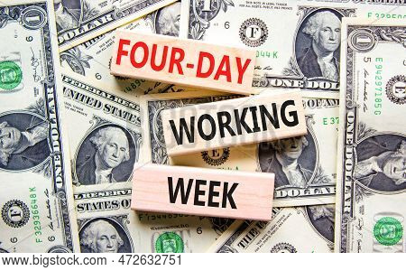 Four-day Working Week Symbol. Concept Words Four-day Working Week On Wooden Block On A Beautiful Bac