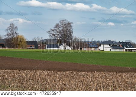 Cropped Fields And Farmhouses At The Flemish Countryside Around Ternat, Flemish Brabant, Belgium
