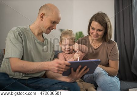 Deaf Child Girl With Cochlear Implant Studying To Hear Sounds And Have Fun With Mother And Father - 
