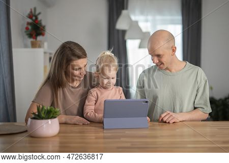 Deaf Child Girl With Cochlear Implant Studying To Hear Sounds And Have Fun With Mother And Father - 