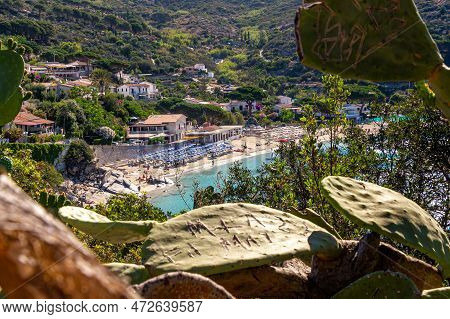 View Over Sandy Colorful Beach Of Little Village Cavoli