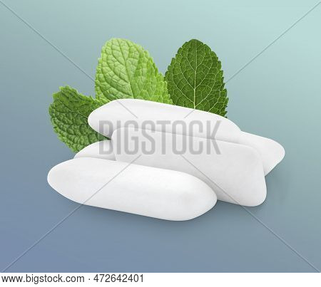 Menthol Chewing Gum Pillows And Mint Leaves On Greyish Blue Background