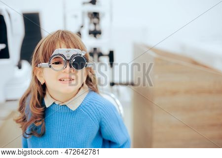 Little Girl Wearing Trial Glasses In Eye Examination Consult Appointment