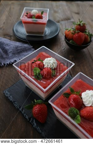 Strawberry Pudding With Cream And Mint Leaves