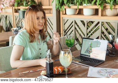 Tver, Russia-august 7, 2022. A Woman With A Laptop Is Studying Human Design. The Concept Of Studying