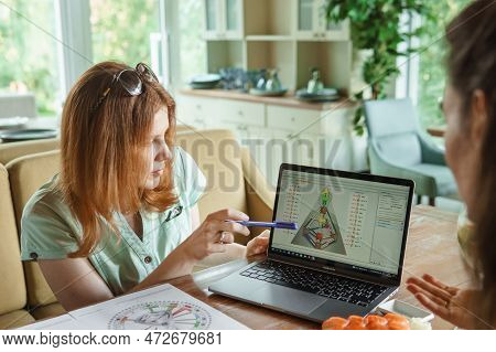 Tver, Russia-august 7, 2022. A Woman With A Laptop Is Studying Human Design. The Concept Of Studying