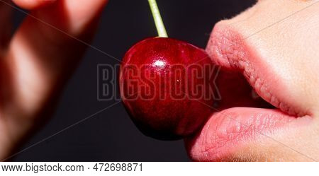 Macro Cherry In Woman Mouth. Cherries On Woman Lips. Glamour Art Lips Concept.