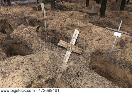 Izium, Ukraine - Mar. 03, 2023: Crosses Are Seen At A Forest Grave Site After An Exhumation In The T