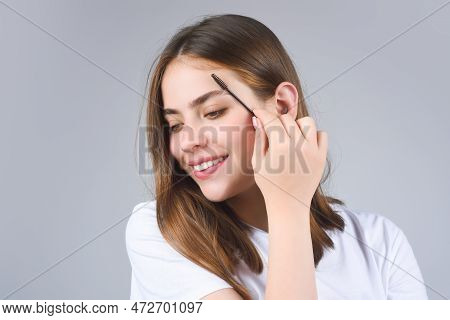 Eyebrow Shaping, Woman Combs Eyebrows With A Brus. Eyebrow Line. Makeup And Cosmetology Concept. Fem