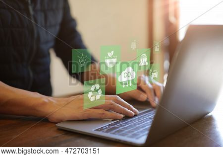Reduce Co2 Emission Concept. Businessman Use Laptop Computer With Environment Icon. Technology Net Z
