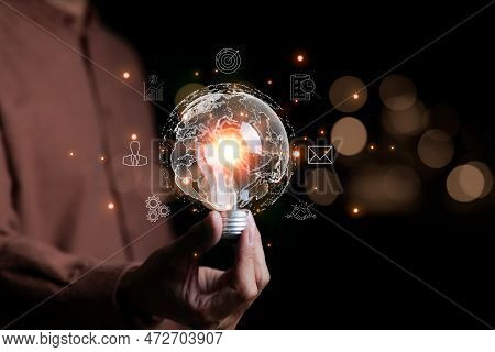 Businessman Hand Holding Creative Light Bulb With Icons Global Internet Connection On Plan Strategy,