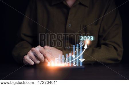 Businessman Analyzes Profitability Of Working Company With Digital Virtual Screen Graphics. 2023 Pla