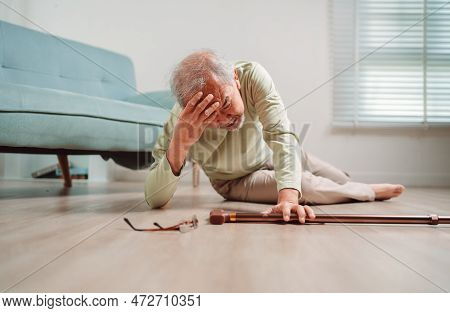 Asian Senior Man Falling On The Ground With Walker In Living Room At Home. Elderly Older Mature Male