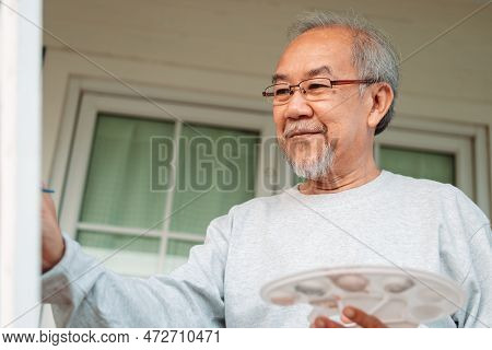 Asian Caregiver Helping Senior Male From Falling On The Ground. Older Elderly Man Patient Having Acc