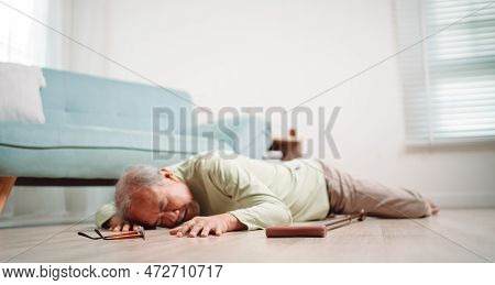 Asian Senior Man Falling On The Ground With Walker In Living Room At Home. Elderly Older Mature Male