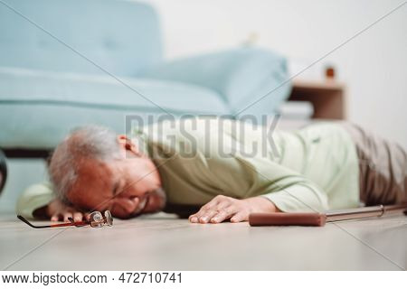 Asian Senior Man Falling On The Ground With Walker In Living Room At Home. Elderly Older Mature Male