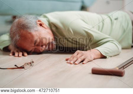 Asian Senior Man Falling On The Ground With Walker In Living Room At Home. Elderly Older Mature Male