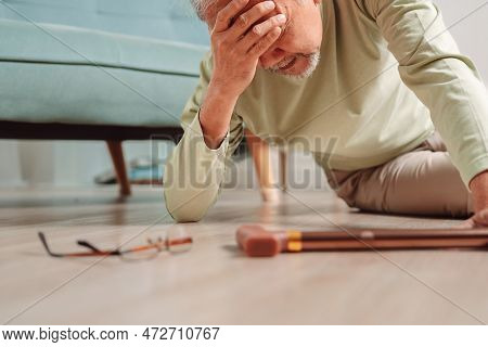 Asian Senior Man Falling On The Ground With Walker In Living Room At Home. Elderly Older Mature Male