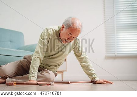 Asian Senior Man Falling On The Ground With Walker In Living Room At Home. Elderly Older Mature Male
