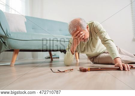 Asian Senior Man Falling On The Ground With Walker In Living Room At Home. Elderly Older Mature Male