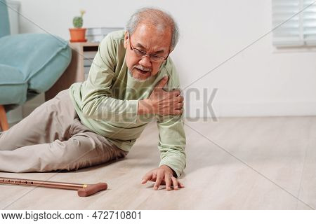 Asian Senior Man Falling On The Ground With Walker In Living Room At Home. Elderly Older Mature Male