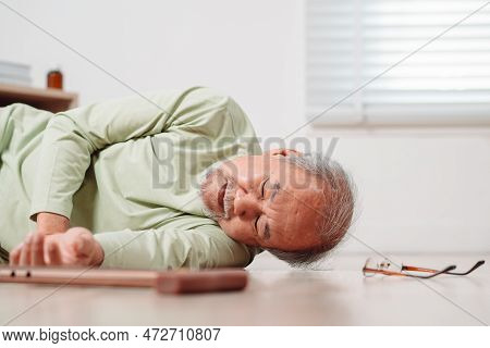 Asian Senior Man Falling On The Ground With Walker In Living Room At Home. Elderly Older Mature Male