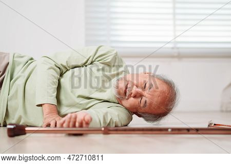 Asian Senior Man Falling On The Ground With Walker In Living Room At Home. Elderly Older Mature Male