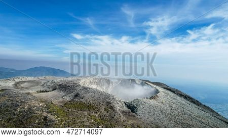 Seeing The Inside Of A Volcano Crater With Smoke In East Java, Indonesia. Aerial View Of Volcano Cra