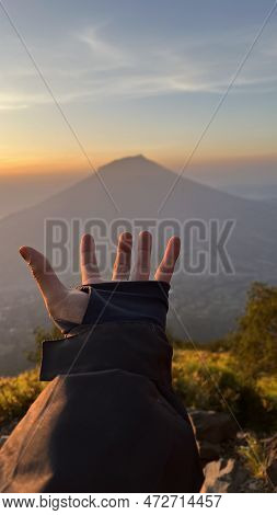 Mountains Under Mist In The Morning In Sindoro Mountain County. West Java, Indonesia, March 16, 2023