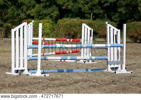 Show Jumping Poles Obstacles, Barriers, Waiting For Riders On Show Jumping Training. Horse Obstacle 