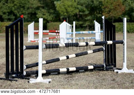 Show Jumping Poles Obstacles, Barriers, Waiting For Riders On Show Jumping Training. Horse Obstacle 