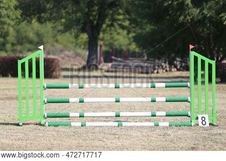 Show Jumping Poles Obstacles, Barriers, Waiting For Riders On Show Jumping Training. Horse Obstacle 