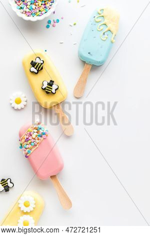Homemade Springtime Themed Cakesicles With Sprinkles And Edible Decorations.