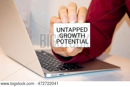A Person Holds A Card Labeled Untapped Growth Potential.