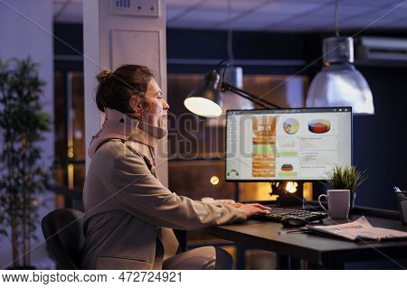 Injured Corporate Employee Yawning Late At Night In Startup Office, Working Overhours At Company Str