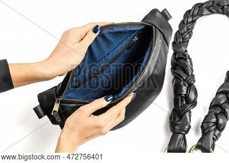 Female Hands Opening Black Genuine Leather Waistbag Showing Blue Fabric Inner Lining. Handmade Leath