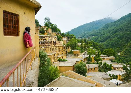 Tourist Woman Walk In Scenic Masuleh Village In North East Iran - Popular Famous Tourism Destination
