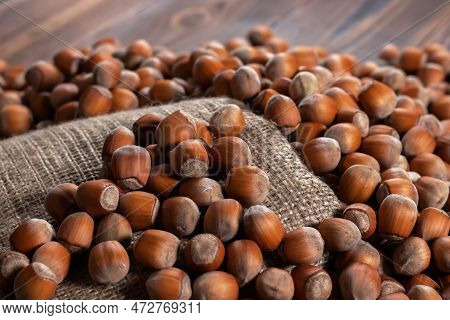 Hazelnuts, Filbert On Old Wooden Table. Heap Or Stack Of Hazel Nuts. Hazelnut Background, Healty Foo
