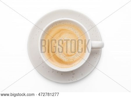 Black Fresh Hot Creamy Coffee In Light Porcelain Cup On White Background.top View.