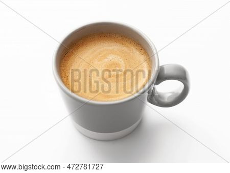 Fresh Black Creamy Coffee In Small Cup On White.