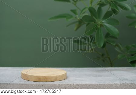Wood Podium On Concrete Table Top Floor Tropical Plant With Blurred Dark Green Background.healthy Na