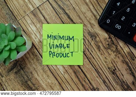 Concept Of Minimum Viable Product Write On Sticky Notes Isolated On Wooden Table.