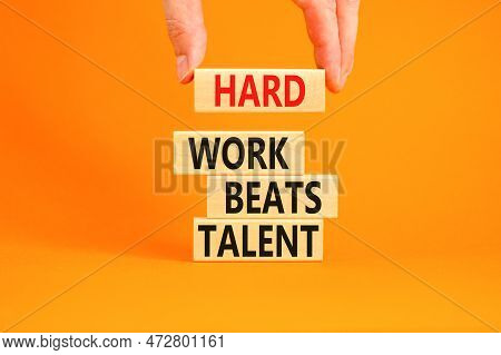 Hard Work Beats Talent Symbol. Concept Words Hard Work Beats Talent On Wooden Block. Beautiful Orang